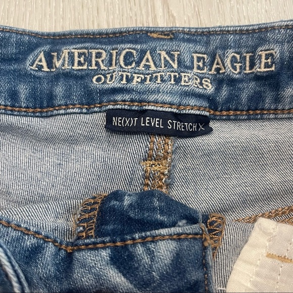 AMERICAN EAGLE Next Level Stretch Hi-Rise Shortie Distressed Blue Jean Shorts - Picture 7 of 9